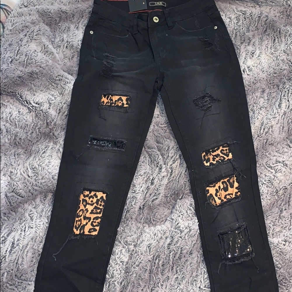 Women’s size 6 L&B black pants with cheetah